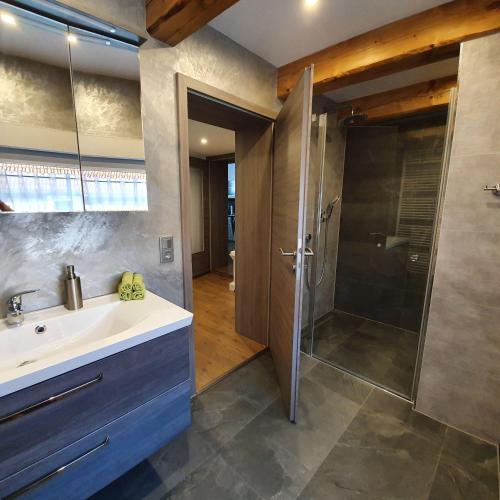 a bathroom with a sink and a shower at Ferienwohnung-Am-Markt in Harzgerode
