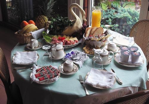 a table with a blue table cloth with food on it at Hotel San Giorgio in Sangano
