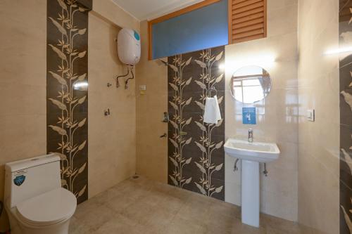 a bathroom with a toilet and a sink at Zostel Dobhi, Manali in Nagar