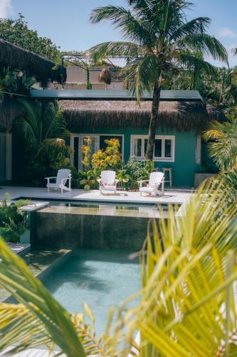 a house with a swimming pool in front of a house at Cactus Lodge Pipa in Pipa