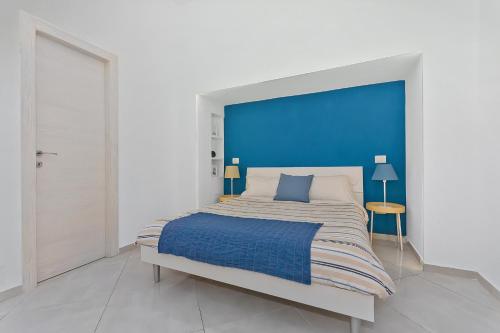 Un pat sau paturi într-o cameră la Blunotte Torino - Piazza Castello