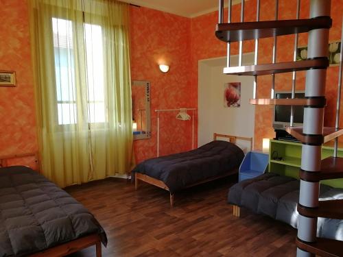 Ένα ή περισσότερα κρεβάτια σε δωμάτιο στο Il Glicine Apartment Rimini