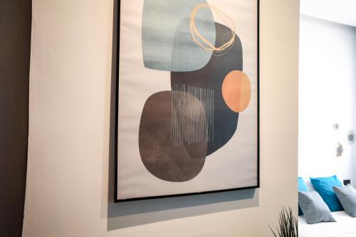 a framed picture on a wall in a room at Materdays 24 in Naples