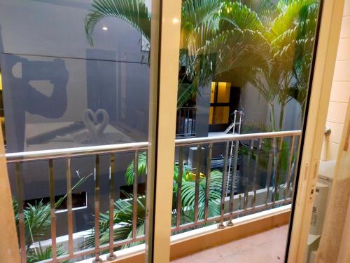 a balcony with a view of a building at soi2inn in Pattaya Central