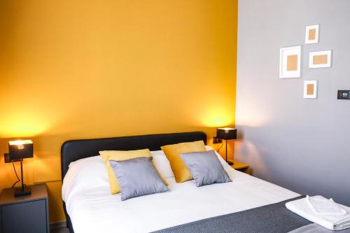 a bedroom with a white bed with two pillows at Materdays 24 in Naples