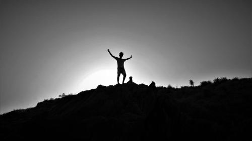 a person standing on top of a hill at HosteLife Gokarna in Gokarna