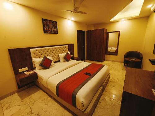 a bedroom with a large bed in a room at Mayda Inn- A Boutique Hotel in New Delhi
