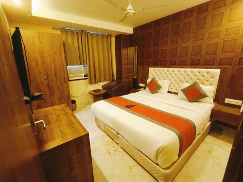a bedroom with a large bed in a room at Mayda Inn- A Boutique Hotel in New Delhi