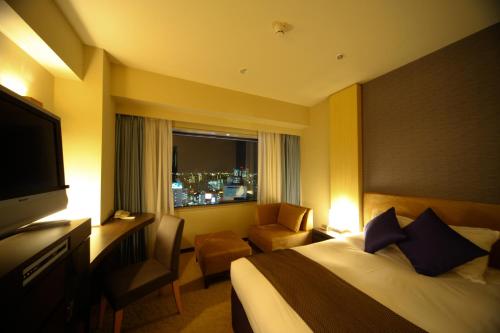 Un ou plusieurs lits dans un hébergement de l'établissement Hotel Metropolitan Sendai