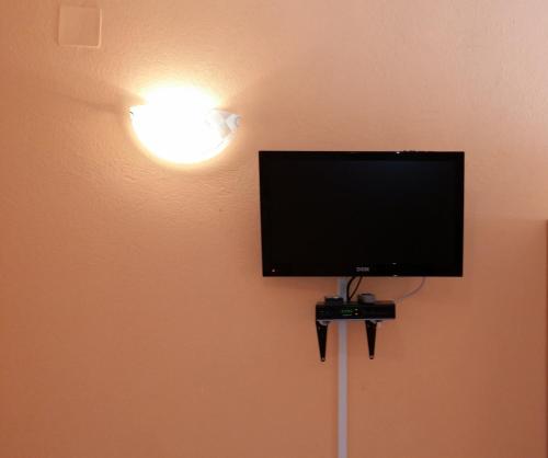 TV a/nebo společenská místnost v ubytování Apartmans Hari