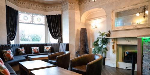 a living room with a couch and a fireplace at Fox lodge in Blackpool