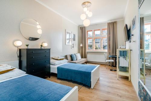 En eller flere senge i et værelse på Bright Apartment in Michle by Prague Days