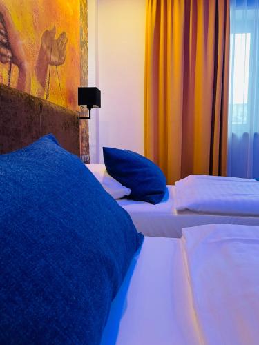 Ένα ή περισσότερα κρεβάτια σε δωμάτιο στο La Petite APARTMENTS & ROOMS