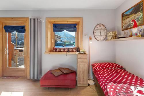 A bed or beds in a room at Baita del Sole Appartamento 3