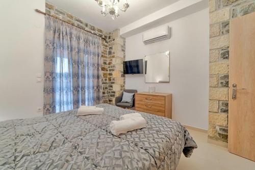 Ένα ή περισσότερα κρεβάτια σε δωμάτιο στο Faraggi Villas