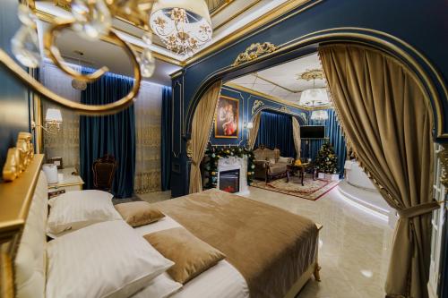 a bedroom with a large bed with a large mirror at Hotel "VITAMIN" in Krasnodar