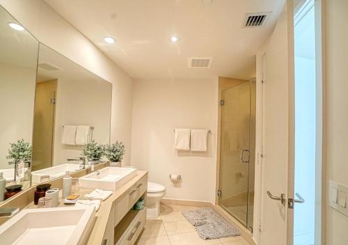 a bathroom with a sink and a toilet and a shower at Lyfe Resort on Miami Hollywood BeachFront by MRA in Hollywood