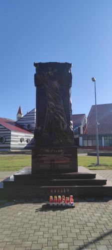 a statue with five bottles of beer in front of it at Apartman Luka in Kupres