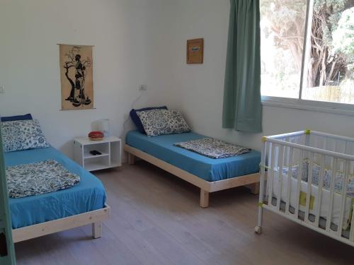Cama o camas de una habitación en נוריתא