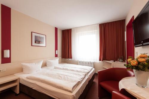 Säng eller sängar i ett rum på Panorama Hotel Bansin