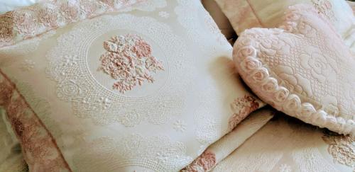 a white lace pillow with a heart on it at Shalanda in Odesa