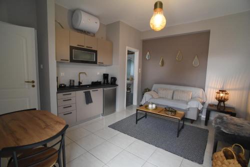 a living room with a couch and a table at Memory House in Megara