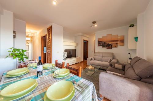 a living room with a table and a couch at MEDANO4YOU The Rosuca Holiday Home in El Médano