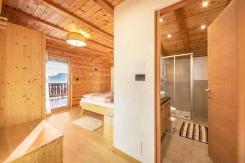 a wooden cabin with a shower and a window at Malgorerhof Sonja in San Genesio Atesino