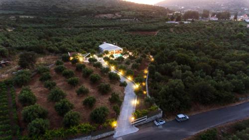 an aerial view of a road with cars parked on it at Villa Avra - With Private Pool in Melidhónion
