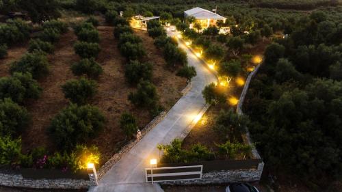 an empty street at night with street lights at Villa Avra - With Private Pool in Melidhónion