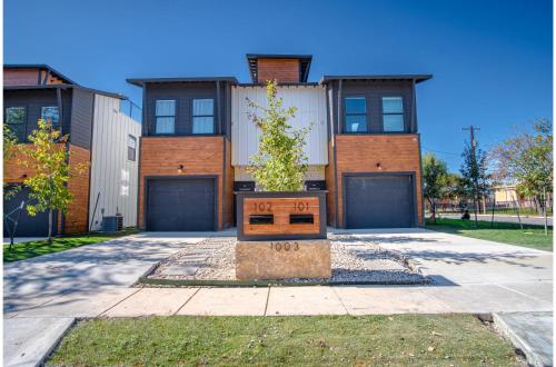 a house with a tree in the front of it at Spectacular 3 BR plus 2 and a half BA Apt Near Downtown in San Antonio