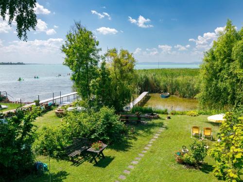 a park with a view of the water at Apartment Sunset by Interhome in Szántód