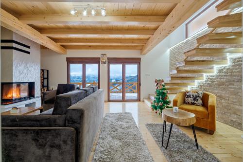 a living room with couches and a christmas tree at Idila Zaovinskog jezera in Zaovine