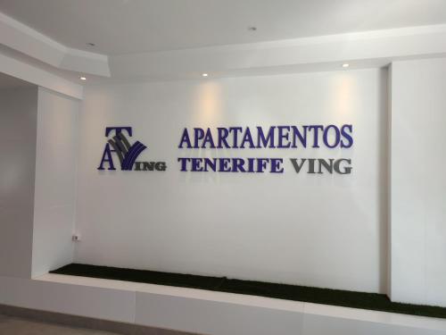 a sign for the american inventors archive tentative wing on a white wall at Tenerife Ving in Puerto de la Cruz