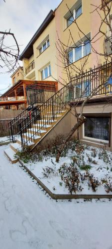 a house with a staircase in the snow at Nad Morzem in Gdańsk