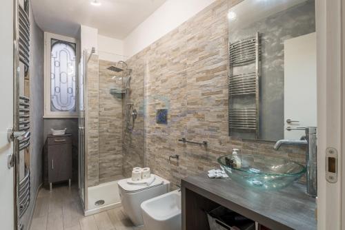 a bathroom with a sink and a toilet and a shower at NEW! Completely renovated apt in Vatican! in Rome