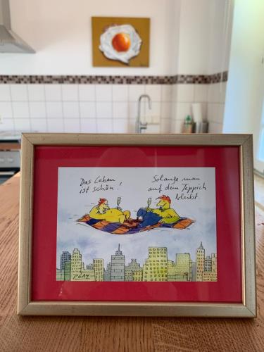 a picture frame with a picture of the simpsons at trash de luxe in Schleswig