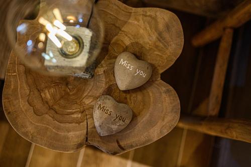 a couple of hearts on a wooden table at Cleopatra's Miramare in Damouchari