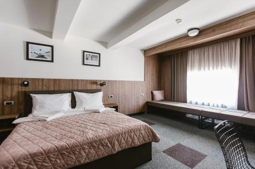 Krevet ili kreveti u jedinici u okviru objekta Rtanj Kopaonik Eco Resort & Spa