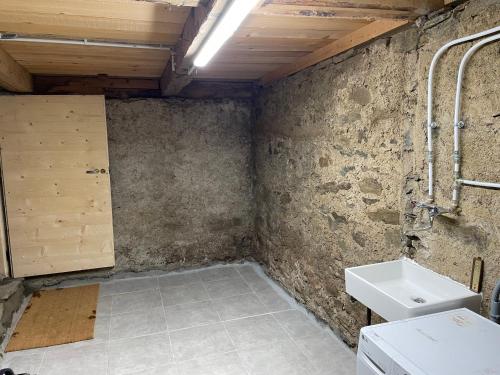 a bathroom with a sink and a toilet at La Grange d'Anaïs in Beaufort