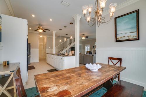 a kitchen and dining room with a wooden table at 30A Beach House - Walking on Sunshine in Inlet Beach