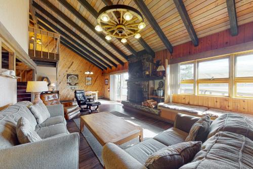 a living room with a couch and a fireplace at Meadowlark in Joseph