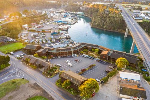 an aerial view of a town next to a river at Harbor Lite Lodge in Fort Bragg