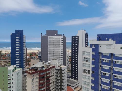 a view of a city with tall buildings at Apartamento no 20 piso com 90m2 e linda vista in Torres