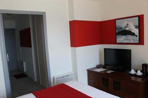 Ein Bett oder Betten in einem Zimmer der Unterkunft Le Poisson d'Avril