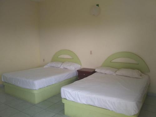 Postel nebo postele na pokoji v ubytování Hotel Azulejos