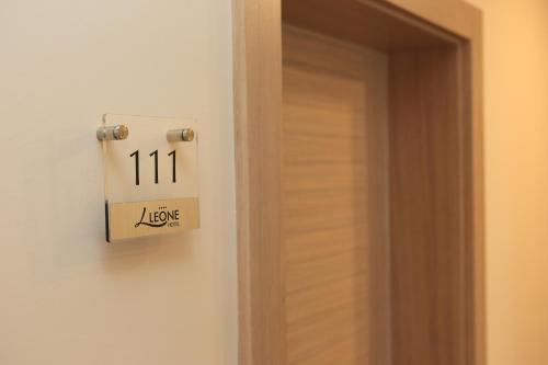 a lightswitch on a wall next to a door at Hotel Leone in Međugorje