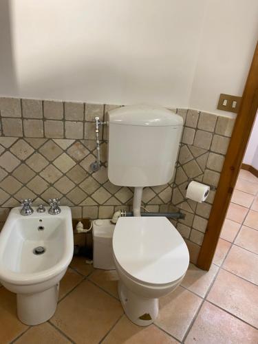 a bathroom with a toilet and a bidet at Frascati Roof 2 in Frascati