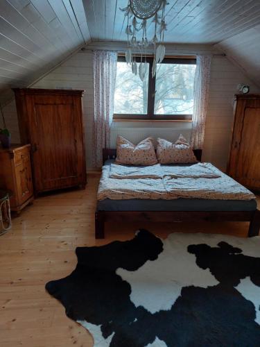 a bedroom with a large bed in a attic at Wellness Srub Jaroměř in Kaplice