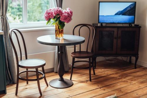 Televizorius ir (arba) pramogų centras apgyvendinimo įstaigoje Olive Apartment